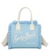 T11411 - Bolso bandolera y de mano para la playa con flecos y con letras bordadas
