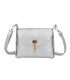 T11768 - Bolso pequeño con adorno de pluma dorada