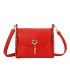 T11768 - Bolso pequeño con adorno de pluma dorada