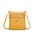 T11802 - Bandolera mini flor con emblema