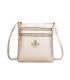 T11802 - Bandolera mini flor con emblema