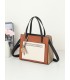 T11575 - Bolso con bandolera de estilo bicolor con un bolsillo de cremallera frontal