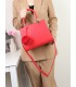 T11562 - Bolso bandolera con asas pequeñas y borla textura cuarteada